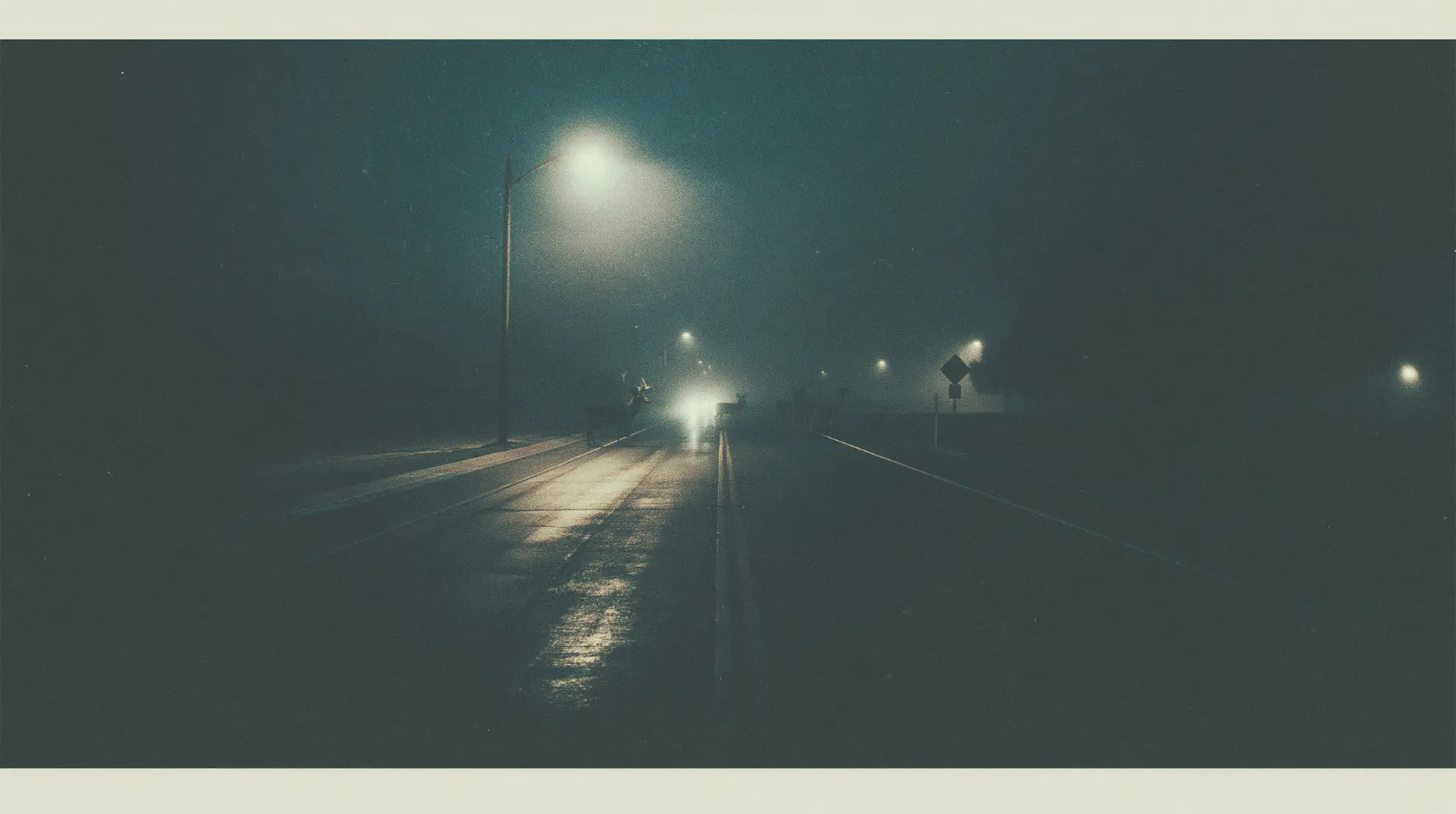 A cinematic night road under dark sky and distant light